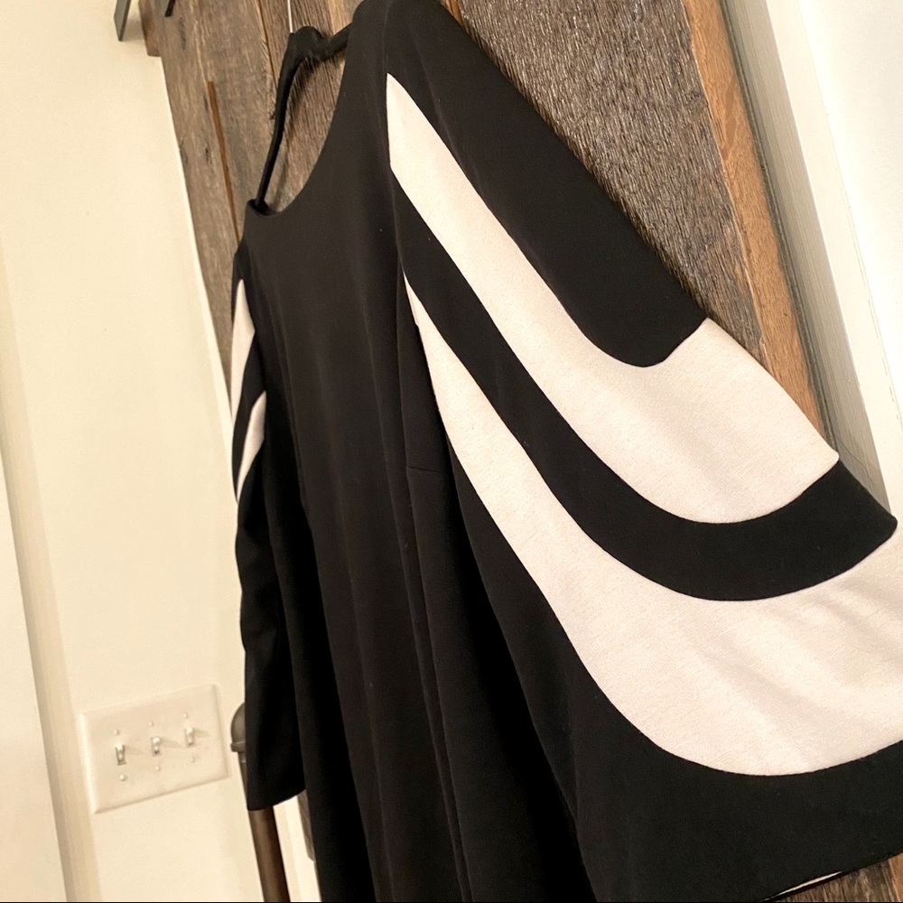 Black Jessica Howard dress. Checkout those sleeves